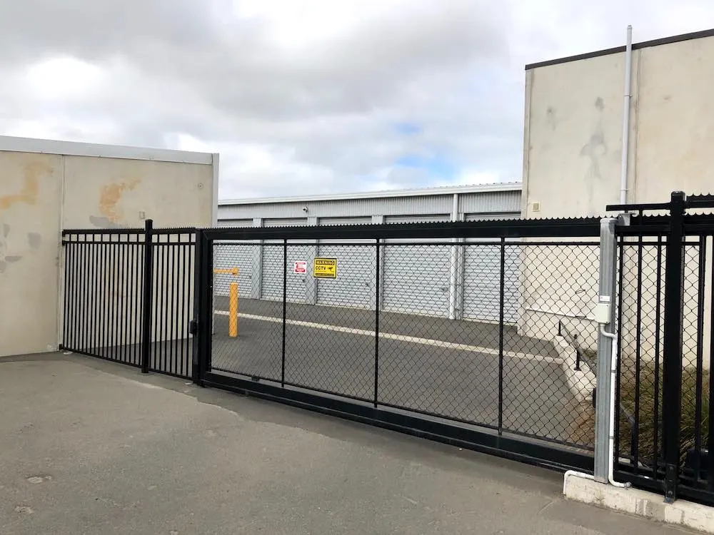 The electric security gate at the entrance to the storage yard